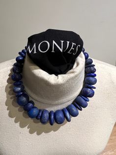 Beautiful original blue necklace by Danish design brand Monies from Copenhagen, Denmark. Necklace is as good as new. Barely worn a few times. Necklace dates from 2017. This 34 stones chain of pure natural lapis lazuli gems is very elegant. With a weight of 233 grams gram it feels very nice around the neck. Lapis lazuli is a very spiritual stone. It promotes spiritual strength, spiritual skills, astral travel, enlightenment, wisdom and gives inner peace and tranquility. The stone makes honest, si Royal Blue Lapis Lazuli Necklaces With Round Beads, Royal Blue Lapis Lazuli Necklace With Round Beads, Blue Lapis Lazuli Beaded Gemstone Necklaces, Blue Lapis Lazuli Beaded Gemstone Necklace, Blue Lapis Lazuli Gemstone Beaded Necklaces, Handmade Royal Blue Lapis Lazuli Jewelry, Royal Blue Round Beads Necklace For Gift, Handmade Blue Lapis Lazuli Necklace, Blue Lapis Lazuli Gemstone Bead Necklaces