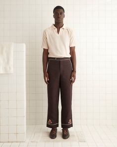 These trousers are inspired by an embroidered Western shirt, circa 1960s. We reproduced the embroidered horses and crisp contrast stitching along the waistband, hem, and pockets of this style. The trousers have a mid-rise and a straight leg. Side buckle waist adjusters for ideal fit Two side slash pockets Two back flap Fitted Cotton Bottoms With Embroidered Hem, Embroidered Fitted Pants For Workwear, Fitted Embroidered Pants For Workwear, Embroidered Wide Leg Workwear Bottoms, Casual Embroidered Pants For Work, Embroidered Straight Pants For Workwear, Embroidered Trousers For Work, Embroidered Western Shirt, 60s Aesthetic