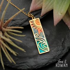 This Handmade Beach Vertical Bar Necklace is a beautiful gift for anyone who is enchanted with the beach!  This brightly colored Ocean Waves Pendant has been carefully handmade and painted in our studio. The ocean has been seen as a symbol of power and strength in ancient cultures. Today, it is used as a symbol  of mystery, endlessness, and constant change. This beautiful necklace has an eye-catching appearance that would look great with any outfit! This pendant is made from brass cutouts and br Personalized Bohemian Jewelry, Colorful Bohemian Jewelry For Vacation, Gold Spiritual Jewelry For Vacation, Ocean-inspired Necklaces As Summer Gifts, Ocean-inspired Necklaces For Summer Gifts, Personalized Blue Bohemian Jewelry, Bohemian Multicolor Rectangular Jewelry, Artistic Handmade Beach Jewelry, Green Ocean-inspired Jewelry For Vacation