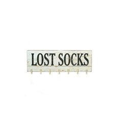 a wooden sign that says lost socks hanging on a clothes line against a white background