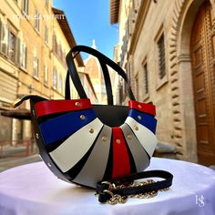 This bag has been made of the best genuine leather by local master crafters of Florence in Italy, designed for women who only accept premium Italian quality and luxury leather bags and modern Italian fashion. . Sizes: Width: 27 cm / 10.7 inches Height: 18 cm / 7.1 inches Depth: 10 cm / 4 inches color: Multicolor The story of this bag : In the heart of Florence, where the scent of freshly brewed espresso blends with the aroma of fine leather, there exists a small, artisanal shop specializing in e Leather Bags For Women, Handmade Leather Bags, Luxury Leather Bag, Expensive Bag, Italian Leather Bags, Italian Heritage, Leather Bags Handmade, Leather Bags, Accessories Unique