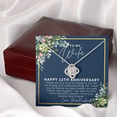 a card with a necklace attached to it