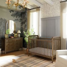 a baby's room with a crib, dresser and mirror on the wall