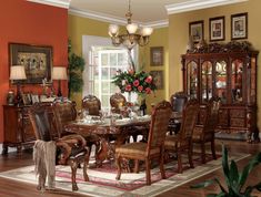 the formal dining room table is set with chairs