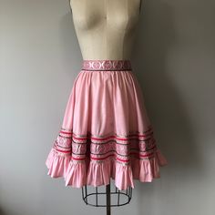 "A beautiful handmade vintage skirt in perfect condition! Size: L Tag - none Era - 50s Material - cotton, ric rac, ribbons (blend), velvet ribbon, metal zipper, metal snap button Waist - 28 to 30\" Hips - free Length - 22\" Washing - lightly steam clean or hand wash cold delicately, hang to dry" Vintage Ruffled Skirt Petticoat, Fitted Vintage Flared Petticoat, Vintage Cotton Mini Skirt, Vintage Cotton Lined Skirt, Vintage Cotton Tiered Skirt, 1950s Fitted Skirt, Vintage Summer Petticoat Skirt, Vintage Skirted Petticoat With Lined Skirt, Vintage Tiered Petticoat With Lined Skirt