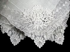 New old stock vintage wedding hanky with a fancy applique and lace border. Although never used, this hanky is slightly imperfect. Please view all photos, as you will see a couple of very small tears in the lace and a small tear in the linen center. Still very pretty, and perfect for a bride-to-be as her something old. All white, measuring 11 inches, and made of linen. Being sold AS IS, and priced accordingly. White Victorian Handkerchiefs With Lace Trim, White Victorian Handkerchief With Lace Trim, Victorian White Handkerchiefs With Lace Trim, Elegant Lace Handkerchiefs With Lace Trim, Vintage Lace With Lace Trim For Ceremony, Elegant Wedding Handkerchief With Lace Work, Elegant Lace Wedding Handkerchief, Elegant Lace Work Handkerchief For Wedding, Elegant Lace Work Wedding Handkerchief