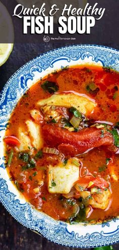 a blue and white bowl filled with fish soup