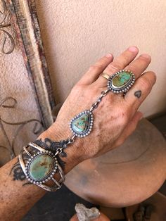 Native American Jewelry Turquoise & Silver Cuff to Ring st by Navajo Brenda Jimenez Chatfields Jewelry Navajo fits most  Nevada Turquoise  Genuine Navajo handmade cuff to ring set!  Freshly created entirely by hand in her traditional Navajo manner, by Brenda Jimenez. She chose 3 stunning and high grade turquoise stones from the Crow Springs mine in Nevada, USA (about 30 miles as the Crow flies, from the Royston mine). A beautiful piece of heirloom Native American jewelry and culture.   One size Vintage Navajo Jewelry, Navajo Women, Turquoise Stone Jewelry, Navajo Turquoise Jewelry, Simple Beaded Necklaces, Silversmithing Jewelry, Cowgirl Accessories, Nevada Usa, Turquoise Jewelry Native American