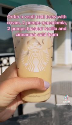 a person holding up a cup with whipped cream on it and the words order a venti cold brew with cream, 2 pumps mac