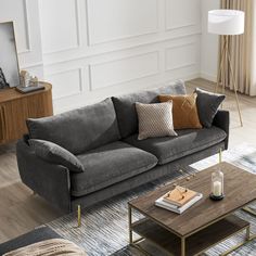 a living room filled with furniture and a coffee table