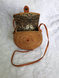 Complete your summer look with our stylish rattan bags. Shop now to enjoy free shipping and stay on-trend with the ultimate boho accessory. All our rattan bags are free shipping all over the World. Diameter 20 cm Lining: traditional Balinese batik (note: the pictures shown are as a sample, we use different pattern of handmade painted batik too) Every single one of these rattan bags is crafted by hand. No two bags are exactly the same, so there might be slight variations in size and color between Western Style Interior, Rattan Bags, Boho Chic Bags, Cowhide Rugs, Rattan Bag, Boho Accessories, Bags Shop, Chic Bags, Boho Living