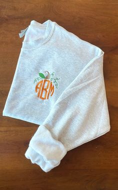 Pumpkin Monogram Embroidered Sweatshirt  Sizes are Unisex  Available in various sizes with the option to change thread colors Also available in shirts, sweatshirts, & hoodies If you don't see the color scheme you want listed, don't hesitate to message us & we'll make it the way you like! Thank you for shopping small!! Sweatshirt Monogram Ideas, Heat Press Sweatshirt Ideas, Fall Sweatshirts Cricut, Monogram Shirt Ideas, Fall Crew Tops With Letter Embroidery, Custom Embroidered Long Sleeve Top For Halloween, Crew Neck Top With Custom Embroidery For Fall, Casual Halloween Top With Embroidered Logo, Fall Crew Neck Tops With Machine Embroidery