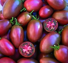 a pile of red tomatoes sitting on top of each other