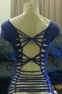 a mannequin wearing a blue top with cutouts on it's back