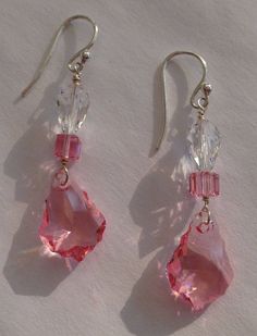 Sweetheart pink crystals and clear crystals. Sterling Silver Ear wires. Teardrop, square and shield shapes. One of a kind earrings. Please Note: The color in the video is muted. The actual color of the pink crystals is like the other photos. Affordable Pink Wire Wrapped Earrings, Cheap Handmade Pink Crystal Earrings, Pink Crystal Earrings For Pierced Ears, Handmade Pink Crystal Earrings, Pink Hypoallergenic Dangle Crystal Earrings, Pink Crystal Dangle Earrings With Ear Wire, Shield Shapes, Valley Village, Think Pink