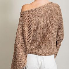 Elevate your casual style with the Loose Fit Knit Top. This solid long sleeve knit sweater top offers a unique twist with its boat neckline, creating a cold shoulder effect that's both trendy and comfortable. Its relaxed and loose fit body ensures all-day comfort, making it perfect for various occasions. Whether you want to keep it casual with jeans or dress it up for a fancier look with a dress, this versatile top has got you covered. It's a must-have addition to your wardrobe, offering both st Slouchy Chic Chunky Knit Sweater, Casual Slouchy Chunky Knit Sweater, Slouchy Textured Knit Long Sleeve Sweater, Slouchy Soft Knit Sweater For Spring, Slouchy Knit Tops, Trendy Open Knit Top For Fall, Casual Chunky Knit Top With Batwing Sleeves, Open Knit Batwing Sleeve Sweater For Fall, Fall Open Knit Sweater With Batwing Sleeve