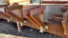 a wooden deck with steps and railings