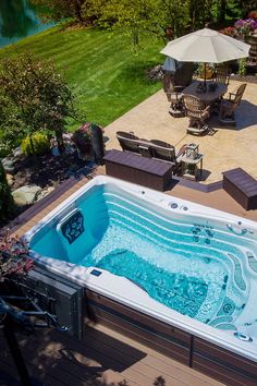 an aerial view of a hot tub and patio