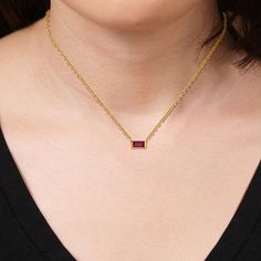 10K Yellow Gold Created Gemstone Horizontal Solitaire 18" Necklace  This simple, but sophisticated necklace features your choice of a single, rectangular, step-cut gemstone paired with a fashionable rope chain.         Necklace approx. 18"L; drop approx. 1/8"L x 1/4"W     Stamped 10K yellow gold     Rope chain; spring ring clasp   Stone Information       All sizes and weights approximate     Created Emerald - Step-cut baguette; 0.16ct     Created Ruby - Step-cut baguette; 0.23ct Rectangular Gemstone Necklace For Formal Occasions, Formal Rectangular Gemstone Necklace, Elegant Red Rectangular Necklace, Rectangular Gemstone Necklace For Anniversary, Baguette Necklace, Gold Rope Chains, Rope Chain Necklace, Step Cut, Rope Chain