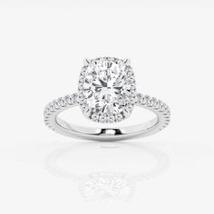 a diamond engagement ring on a white background