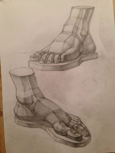 two drawings of feet and one is in the process of drawing