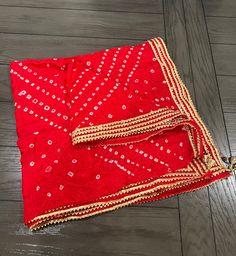 Bandhej Red Gota dupatta, Chinon silk dupatta, Bandhani dupatta, Bridesmaids Gift, Indian dupatta, 2.25 meter dupatta  Description:  * Beautiful style weave , exact match for Traditional wear sets or any ethnic sets. * This silk Dupatta is suitable for picnic, outdoor, travelling, cycling, dancing and stage performance.   * Use it as casual or formal wear for office, shopping, daily wear in home, college, family, meetings,     festive occasions. * You can use these dupattas to gift as wedding favor, return favor etc. * Dimension: Dupatta Length: 2.25 Meters - Dupatta Width: 34 Inch Best use for gifting purposes. It can be wore on any occasion and with any outfit. You can gift this to your sister as Diwali gift  OCCASION: PARTY WEAR, WEDDING, MARRIAGES, CASUAL, DAILY WEAR These Earrings set Red Sharara With Dupatta For Diwali, Red Salwar Kameez With Dupatta For Navratri, Red Saree With Sheer Dupatta For Eid, Dupatta With Pallu For Puja During Eid, Red Anarkali Set With Gota Work For Traditional Ceremonies, Red Bollywood Lehenga With Bandhani Print, Unstitched Red Saree With Sheer Dupatta, Red Saree With Sheer Dupatta For Festivals, Red Saree With Sheer Dupatta Material