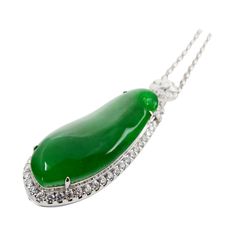 Please check out the HD video! Here is a rare imperial green Jade and diamond pendant. It is certified. The pendant is set in 18k white gold and diamonds. Not only does this jade have the best color, it is also got size and thickness. The jade material used is the center of the rough (best material). There are diamonds that surrounds the imperial jade center stone, diamonds on top of the Jade and also diamonds in the back totaling 2.143Cts. The untreated / unenhanced natural jade is translucent. Imperial Jade, Diamond Drop Pendant, Carved Heart, Drop Pendant Necklace, White Gold Chains, Jade Jewelry, Statement Pendant, Diamond Drops, Natural Jade