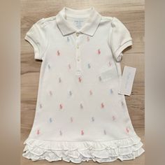 24 Months Baby Girls Ruffled Pony Printed Polo Dress 1 Piece White Sweet Dress With Ruffle Hem, Ruffled Dresses For Playwear With Short Sleeves, White Ruffle Hem Dress For Playdate, Playful White Dress With Ruffle Hem, Sweet White Dress For Playtime, White Fitted Dress For Playwear, Lauren White, Girl Shirt, Ralph Lauren Dresses