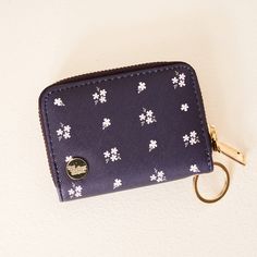 Unwrap a burst of floral fun this fall with our Pretty Posies Zip Around Wallet! Not only does it bloom with a delightful design, but it's also packed with practicality. With a handy keyring, 14 card slots inside, and even an exterior clear ID slot, this wallet keeps your essentials neat and tidy. Compact yet surprisingly spacious, it's the perfect companion for anyone who loves to keep things organized – and stylish! Treat yourself or gift it to someone special who adores a touch of floral flai Purple Games, Teacher Holiday Gifts, Gender Neutral Clothes, Wrist Wallet, Keychain Wallet, Sorority Gifts, Coin Holder, Notebook Gifts, Wristlet Keychain