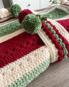 a crocheted bag sitting on top of a bed