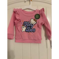 Sanrio Hello Kitty “Hey Boo” Halloween Pink Sweatshirt. Baby Girls Size 12 Months. Long Sleeve, Ruffle Sleeve, Crew Neck. Glow In The Dark Print. New With Tags. Pink Character Print Tops For Playtime, Pink Tops With Character Print For Playtime, Pink Fall Playwear Top, Kawaii Cotton Tops For Playtime, Pink Kawaii Tops For Fall, Cute Fall T-shirt For Playtime, Cotton Kawaii Tops For Playtime, Hello Kitty Long Sleeve Cotton Top, Long Sleeve Cotton Hello Kitty Top