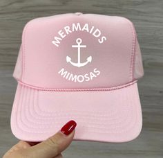 Choose from one of these fun summer colors and hit the beach with our Mermaids & Mimosas trucker hats! TAT: 7-10 business days Fun Summer Snapback Hats, Summer Snapback Hat, White Snapback Hat For Summer, Pink Summer Trucker Hat For Beach, Pink Summer Trucker Hat, Summer Beach Snapback Hat With Curved Brim, Pink Trucker Hat For Summer Beach, Fun Summer Trucker Hat, One Size Fits Most, Fun Summer Trucker Hat One Size Fits Most