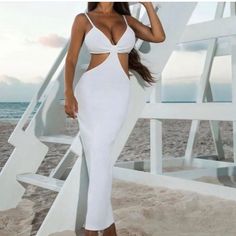 White Cut Out Dress Purchased From A Boutique. Never Worn, No Tags. Size Large Can Fit A Small Or A Medium. Elegant White Bodycon Dress With Cutout, White Fitted Bodycon Dress For Vacation, Chic White Bodycon Dress For Vacation, White V-neck Bodycon Dress For Day Out, White Cutout Bodycon Dress For Date Night, White Cutout Beach Dress, Spring White Cutout Bodycon Dress, White V-neck Bodycon Dress For The Beach, White V-neck Bodycon Dress For Beach