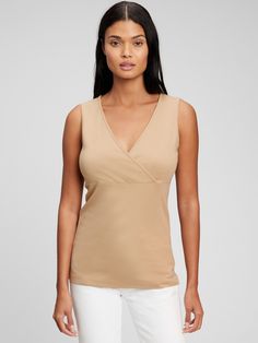 Made with 48% organically grown cotton.  Organic cotton is better for people and the environment because it's grown without the use of harmful synthetic pesticides and fertilizers.  Soft modal-blend jersey.  Crossover V-neck for easy nursing.  Tank straps.  Shirring at empire waist.  Please note: Maternity styles cannot be returned in store.  Please enjoy free returns by mail. Fitted Sleeveless Organic Cotton Top, Gap Tops For Spring, Spring Organic Cotton Stretch Tops, Gap V-neck Summer Tops, Solid Color Cotton V-neck Tank Top, Solid Cotton V-neck Tank Top, Gap V-neck Tops For Spring, Versatile Cotton V-neck Tank Top, Versatile Cotton V-neck Tops