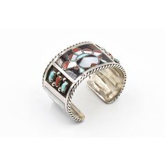 This beautiful bracelet is by Zuni artists Filbert & Clara Gasper. Circa 1960 - 1970. The bracelet is sterling silver with inlay turquoise, mother of pearl and coral. In the center is an inlaid face and on the sides there are additional bezel set turquoise and coral pieces. The next section has inlay mother of pearl rectangles. The piece has a 1" area to get your wrist into. Interior cuff length is 6.75".   Filbert and Clara Gasper are highly recognized and noted Zuni artists that are known for Southwestern Inlay Cuff Bracelet Gift, Collectible Inlay Bracelet Jewelry, Silver Artisan Multi-stone Cuff Bracelet, Southwestern Style Bracelet With Inlay, Southwestern Style Jewelry Bracelet With Inlay, Artisan Silver Multi-stone Cuff Bracelet, Southwestern Inlay Bracelet, Artisan Inlay Bracelets As A Gift, Distinctive Bangle With Inlay For Gifts