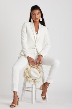 HERES TO STRONG WOMEN...
Look sharp with this classic white womans tuxedo by The Groomsman Suit. It features a beautifully tailored tuxedo jacket and tapered pants with a touch of stretch to make a statement on your wedding day... or in place of an LWD at the rehearsal dinner, bachelorette or any other bridal festivities.  

 
*Fulfilled by our friends at The Groomsman Suit
THE 411
JACKET DETAILS:

Fully-lined with single satin covered button front
Nonfunctional four-button cuffs (satin covered) Wedding Tux Dress For Women, Womens White Wedding Suit, White Wedding Suits For Women Brides, Women’s White Suit, White Tuxedo Women, White Suit Outfit Woman, All White Suit Women, Masc Bride Outfit, Wedding Suit Women Tomboys