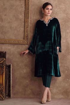 Elevate your winter wardrobe with this elegant green A line velvet kurti, perfect for formal occasions, weddings, and fashion enthusiasts KURTI(Top): This beautiful green velvet kurti features intricate embroidery over the neck,side pocket and back panel. BOTTOM: Complementing the kurti is a straight silk pant for a complete and elegant look. ☑ DUPATTA: The dress will have organza dupatta  Our dresses are custom-made designer-creations tailored to your preferences and measurements.If you desire Full Sleeve Suit, Velvet Kurti, Velvet Suit Design, Velvet Dress Designs, Trouser Suit, Velvet Suit, Velvet Trousers, Zari Work, Net Dupatta