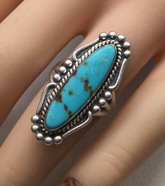 "Beautiful Vintage Bell Trading Post Navajo Turquoise Ring Size 7 Sterling Silver Signed Native American Indian Jewelry Very Good Pre/owned Condition measures 1 1/4\" across." Southwestern Style Turquoise Inlay Ring, Western Turquoise Ring With Inlay, Western Style Turquoise Ring With Inlay, Bohemian Turquoise Concho Ring, Untreated Bohemian Turquoise Ring, Western Style Oval Turquoise Concho Ring, Western Oval Turquoise Ring With Concho, Vintage Turquoise Ring With Inlay, Vintage Turquoise Inlay Ring