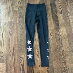 Strut This Leggings. New Without Tags, Originally $94. Black Leggings With Three Purple Iridescent Stars On The Outsides Of Each Leg. Perfect Condition, No Flaws, Never Worn. One-Size (One-Size Fits Most). From A Pet And Smoke Free Home. Price Is Negotiable, Feel Free To Send Me An Offer! :) Star Pants, On The Side, Heat Press, Black Leggings, The Struts, Pant Jumpsuit, Pants For Women, Heat, Leggings