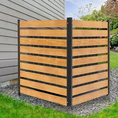 a wooden fence in front of a house