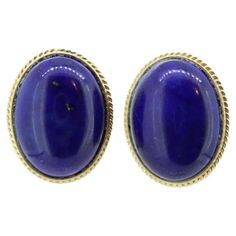 Vintage from the 1990s Materials: Gold Location: Earlobe About this item Beautiful and Unique Earrings. Coiled Cable outline around a Lapis Lazuli oval cabochon. 14k Gold. Yellow Gold Details: 12mm by 16mm lapis 4.9grams total Classic Blue Gemstone Cabochons, Classic Blue Cabochons For Formal Occasion, Blue Classic Cabochons For Formal Occasion, Blue Classic Formal Cabochons, Blue Formal Classic Cabochons, Blue Oval Cabochon Formal Jewelry, Blue Oval Hallmarked Earrings, Elegant Blue Oval Cabochon Earrings, Blue Lapis Lazuli Earrings For Formal Occasions