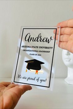 someone is holding up a clear award for an arizona state university graduation ceremony, with the name and date on it