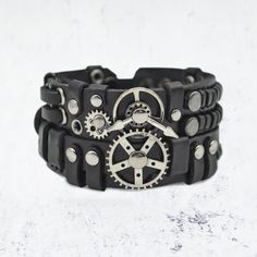 Steampunk Leather black bracelet. Wristband with gears and mechanisms. Handmade. Material: genuine leather, quality materials and accessories. Length - 20 cm. Width - 4,5 cm. Exclusive bracelet in steampunk style with reliable fasteners. Handmade product, so design may be a little bit differ from the photo. The bracelet will add originality and uniqueness to your image. Made in Ukraine. Steampunk Leather, Made In Ukraine, Black Bracelet, Steampunk Style, Black Bracelets, Steampunk Fashion, Bracelet Handmade, Bracelets And Charms, Fashion Watches