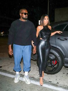 the rapper and his wife are seen walking towards their car