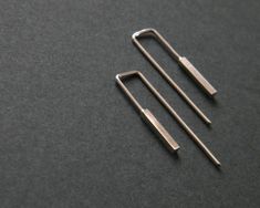 "Minimalist geometric bar earrings that complement to modern and edgy look. Inspired by urban environment and style. These modern silver bar earrings come in 2 finishes. Please choose between dark oxidized silver or bright silver. The bar measures 1 cm = 0.39\" and the whole earring is 2.5 = 0.98 \" cm long. The thread that goes inside the ear is 0.8 mm but if you need I can make it 1 mm thick. Please let me know, its for the same price! Custom orders are welcomed and every listed item can be ad Aqua Accessories, Earrings Edgy, Accessories 2020, Silver Bar Earrings, Edgy Earrings, Dog Ring, Jewelry Cleaning Solution, Silver Bar, Earrings Simple