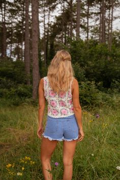 This Ecru and Pink Alisha Top features intricate crochet details, a slightly cropped fit, and charming pink and green floral patterns. Its lightweight fabric allows for a hint of transparency, adding a touch of allure to your look. Ophelie is also wearing the Blue Franck Denim shorts and the Pink Emma Cardigan One size (fits from US sizes 4-8) Length 16.9 in - Width 17.3 in 100% Cotton Washing: 86°F Bohemian Lace Top With Floral Print, Lace Floral Print Tops For Beach, Beach Lace Top With Floral Print, Lace Floral Print Beach Tops, Beach Lace Tops With Floral Print, Lace Tops With Floral Print For Beach, Feminine Summer Lace Top With Floral Embroidery, Summer Floral Print Lace Top, Pink Crochet Top With Lace Trim For Spring