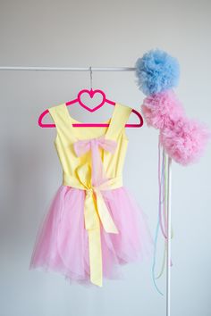 This Pinkie Pie Inspired Tutu dress is perfect for Birthday party, Halloween party and Dress up The dress is made with high quality fabrics. Top of the dress: 100% cotton fabric Bottom of the dress: High quality lycra soft tulle ( soft and not stiff) Lining: 100% cotton fabric There is a corset like closing at the back of the dress which lets to adjust the fit of the dress. There is an elastic band at the back of the waistband. The dress is easy to pull on and very adjustable. This dress is full Pink Sleeveless Fairy Dress For Costume Party, Cute Yellow Princess Dress For Party, Cute Yellow Princess Party Dress, Yellow Summer Party Tutu Dress, Cute Carnival Party Dress, Yellow Princess Style Dress For Costume Party, Cute Yellow Tutu Dress For Party, Easter Party Fitted Tutu Dress, Yellow Princess Dress For Costume Party