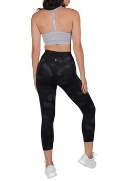 Lounge around in luxury with our innovative LUX material! This super soft, breathable, and thick fabric feels amazing against your skin and also stretches to move with you. Due to the high quality, durable fabric, these camo capris are a great choice for a variety of activities like running. Supportive waistband. Pulls on. Fitted leg. High waisted. Camo print. Approx. 10" rise, 22" inseam (size S). Imported    This item cannot be shipped to Canada. Mid-rise Black Workout Tights, Black Mid-rise Workout Tights, Sporty High Rise Black Tights, Black High Rise Sporty Tights, Black Leggings For Pilates With Medium Support, Black Leggings With Medium Support For Pilates, High Waist Snug Fit Sporty Leggings, Sporty High Waist Snug Fit Leggings, Functional High Rise Black Leggings