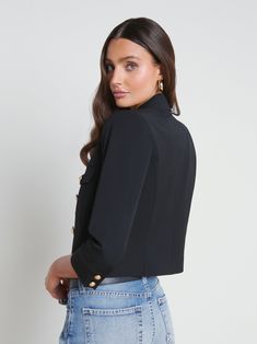 The Kumi is our modern update to the classic three-quarter sleeve jacket. A strong shoulder and tapered silhouette create flattering definition. This easy, goes-with-everything style is crafted from a supple stretch-suiting fabrication and finished with flap pockets and our signature gold embossed dome buttons. Pair with high-waisted denim for a perfectly proportioned look. | L'AGENCE Kumi Cropped Jacket In Black Fitted Formal Outerwear With 3/4 Sleeves, Elegant Formal Blazer With 3/4 Sleeves, Elegant 3/4 Sleeve Blazer For Formal Occasions, Black Double-breasted Cropped Jacket For Work, Chic Fitted Blazer With 3/4 Sleeve, Classic Formal Blazer With 3/4 Sleeve, Elegant Outerwear With Button Closure, 3/4 Sleeve, Chic 3/4 Sleeve Business Casual Outerwear, Chic 3/4 Sleeve Outerwear For Business Casual