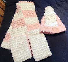 Moss stitch pink and white pocket scarf and hat set. Made with fleece yarn. Handwash only. Cozy White Crochet Hat For Cold Weather, Cozy White Crochet Hat, Cozy Warm White Crochet Hat, Warm Cozy White Crochet Hat, White Crochet Knitted Hat For Cold Weather, White Hand Knitted Crochet Hat For Cold Weather, Crochet Pocket Scarf, Fleece Crochet, Crochet Pocket